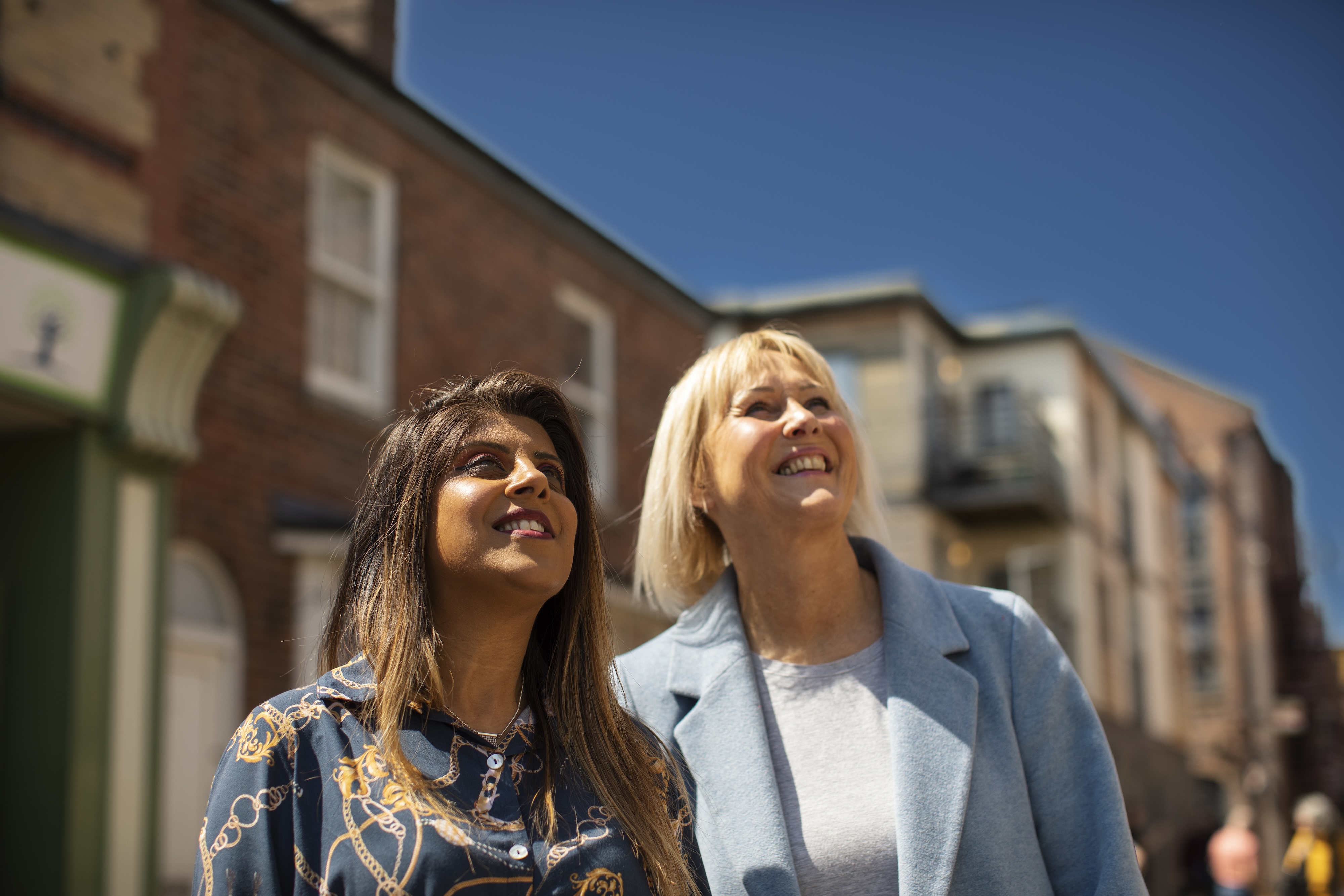 Happy visitors exploring the Coronation Street Experience set in Manchester