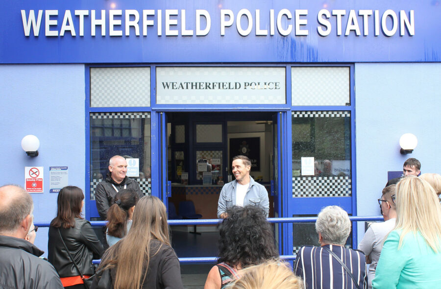 Gareth Pierce, who plays Todd Grimshaw, surprises guests outside the Weatherfield police station at the Coronation Street Tour.