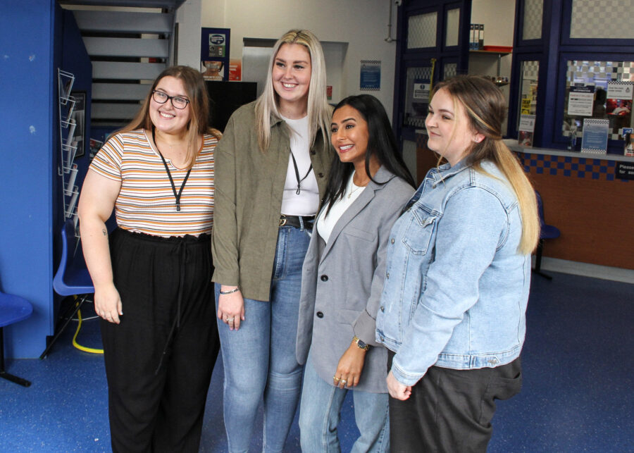 Sair Khan, who plays Coronation Street's Alya Nazir, posing with guests before their guided tour of the production site and sets.